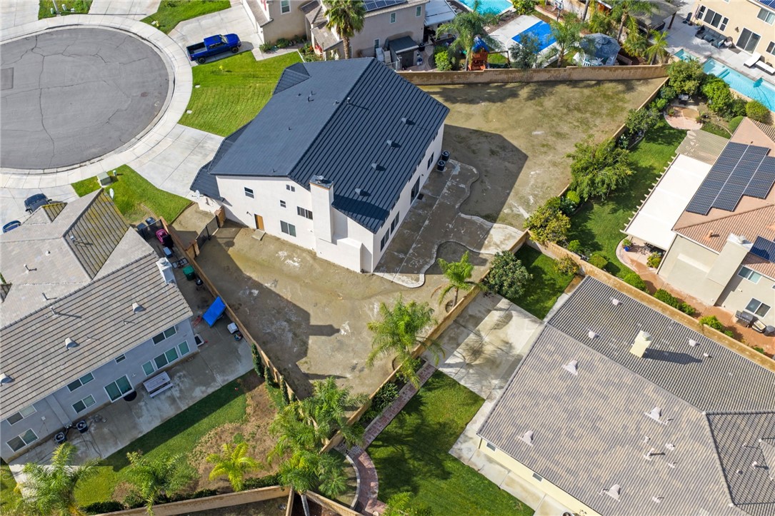 6920 Channel Court Eastvale, CA 91752 - Photo 46 of 57 an aerial view of a house with a swimming pool