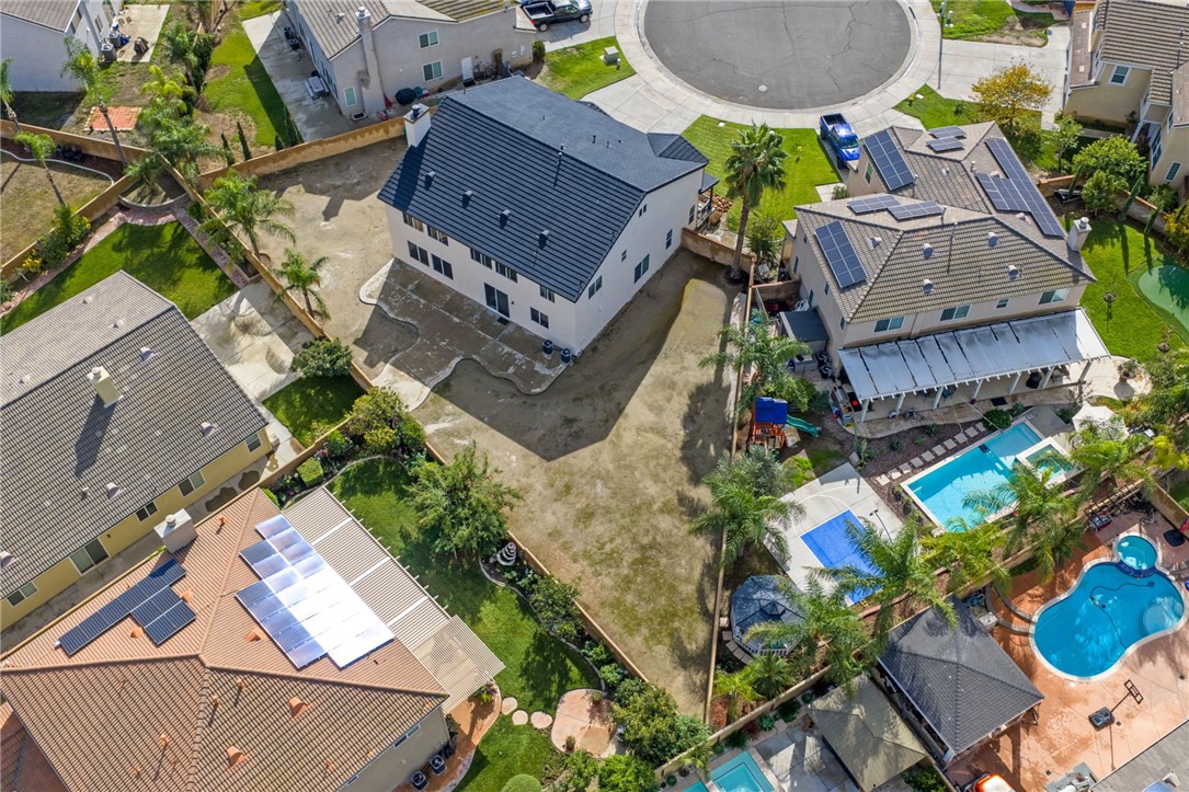 6920 Channel Court Eastvale, CA 91752 - Photo 51 of 57 an aerial view of a house with a garden and outdoor seating