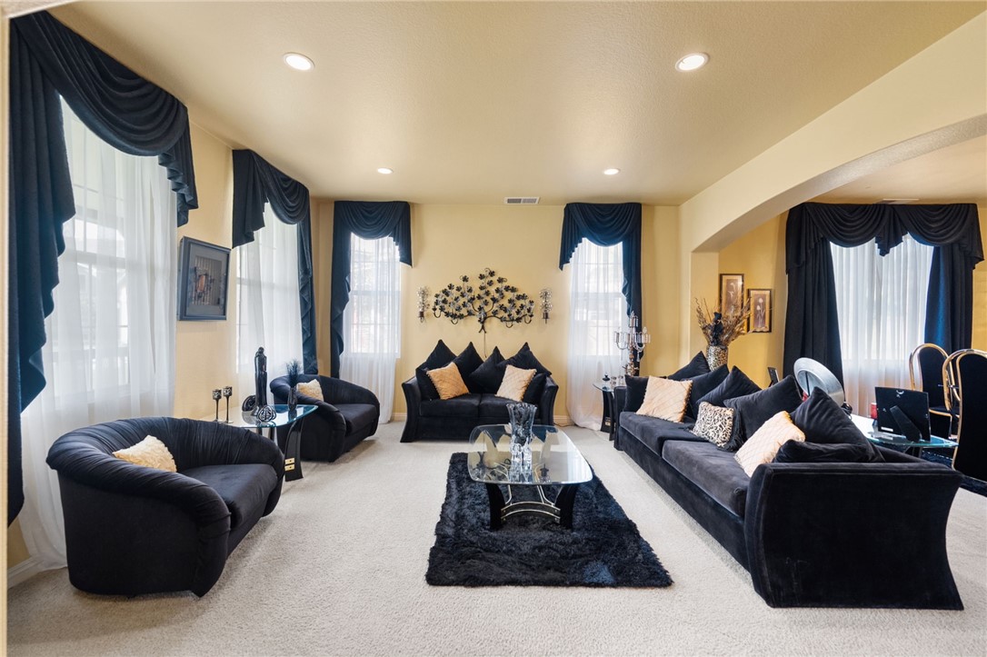 6920 Channel Court Eastvale, CA 91752 - Photo 7 of 57 a living room with furniture and a large window