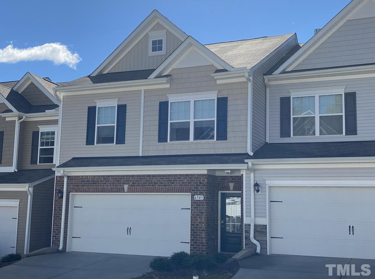 6343 Grace Lily Drive Raleigh, NC 27607 - Photo 1 of 24 a front view of a house with a garage