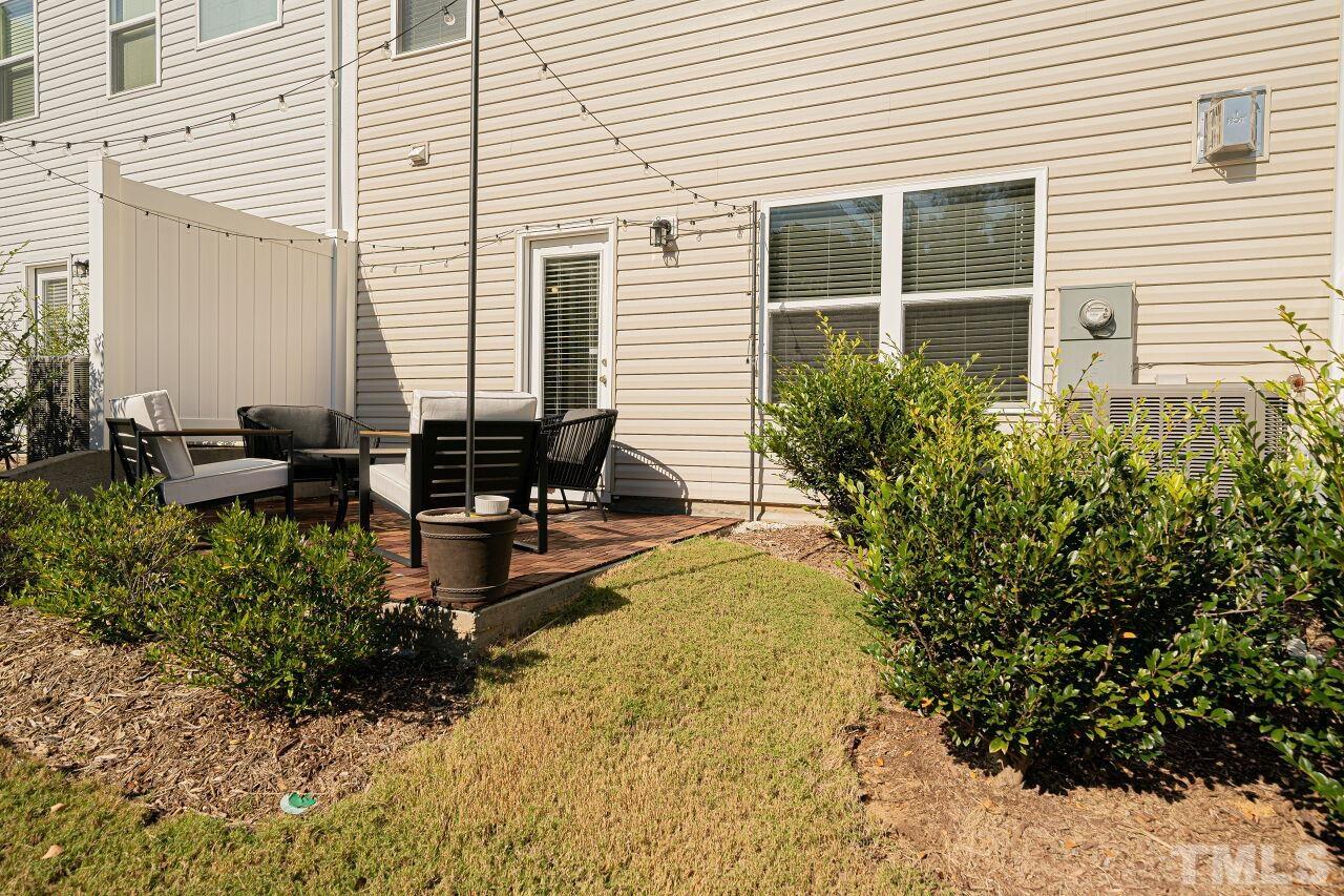 6343 Grace Lily Drive Raleigh, NC 27607 - Photo 24 of 24 a front view of a house with swimming pool and sitting area