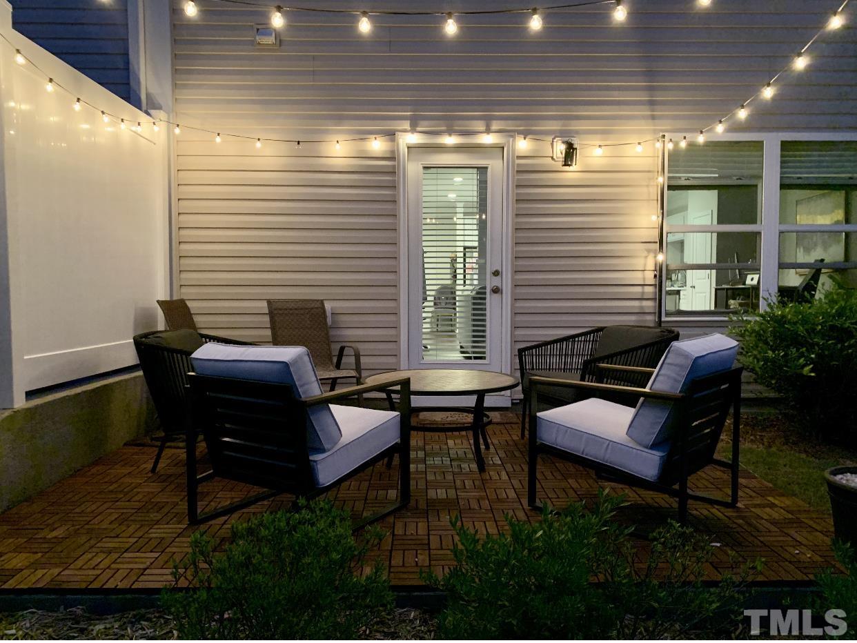 6343 Grace Lily Drive Raleigh, NC 27607 - Photo 3 of 24 a view of a patio with chairs and a potted plant