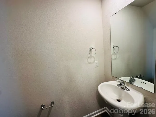 a bathroom with a sink and mirror