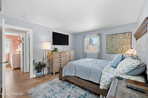 a bedroom with a bed and a closet