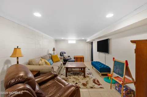 a front view of a house with a yard covered in snow