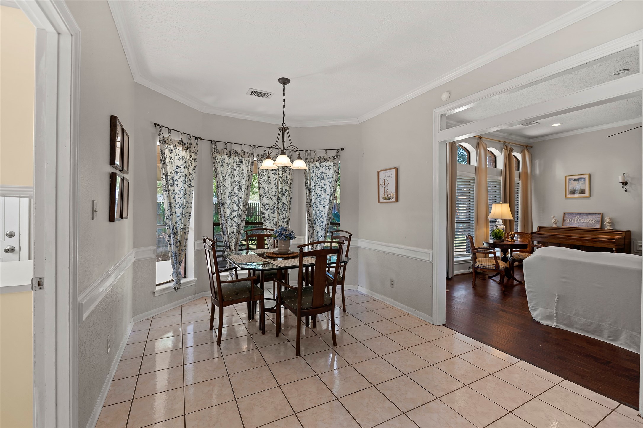 17607 Terrawren Lane Spring, TX 77379 - Photo 12 of 32 a view of a dining room with furniture and chandelier