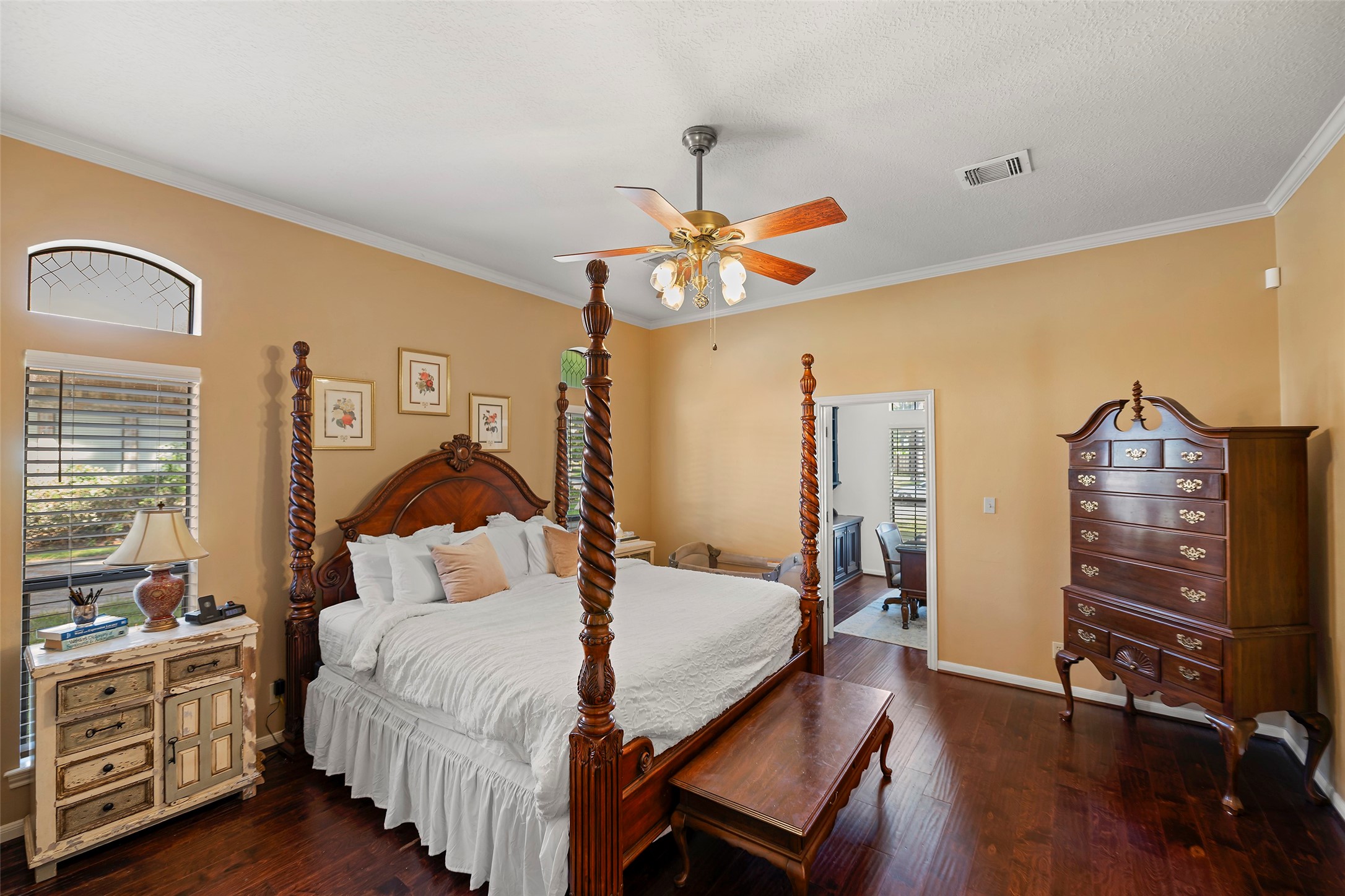 17607 Terrawren Lane Spring, TX 77379 - Photo 13 of 32 a bedroom with a bed a dresser and wooden floor