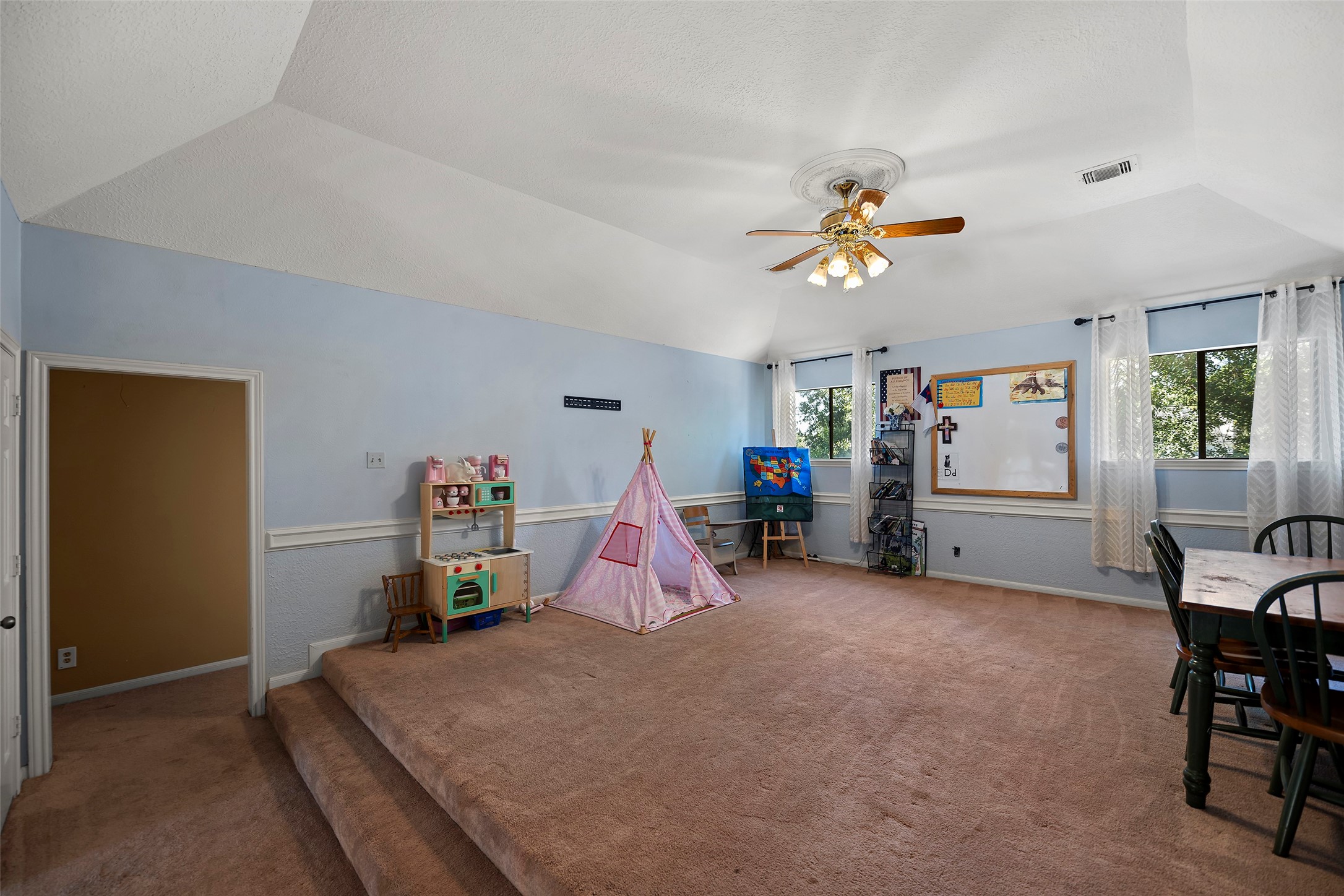 17607 Terrawren Lane Spring, TX 77379 - Photo 18 of 32 a living room with furniture and a chandelier