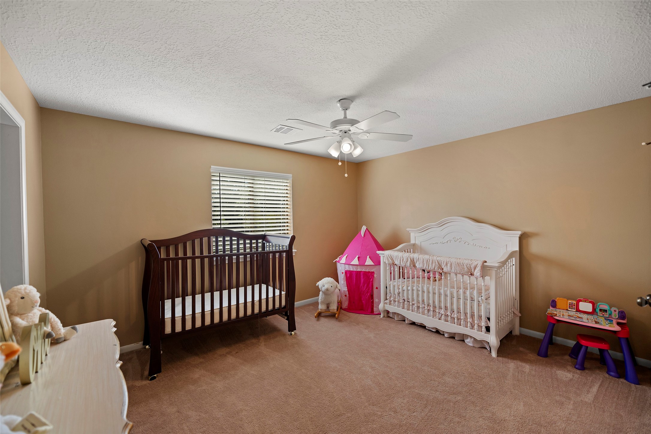 17607 Terrawren Lane Spring, TX 77379 - Photo 21 of 32 a bedroom with furniture and a window