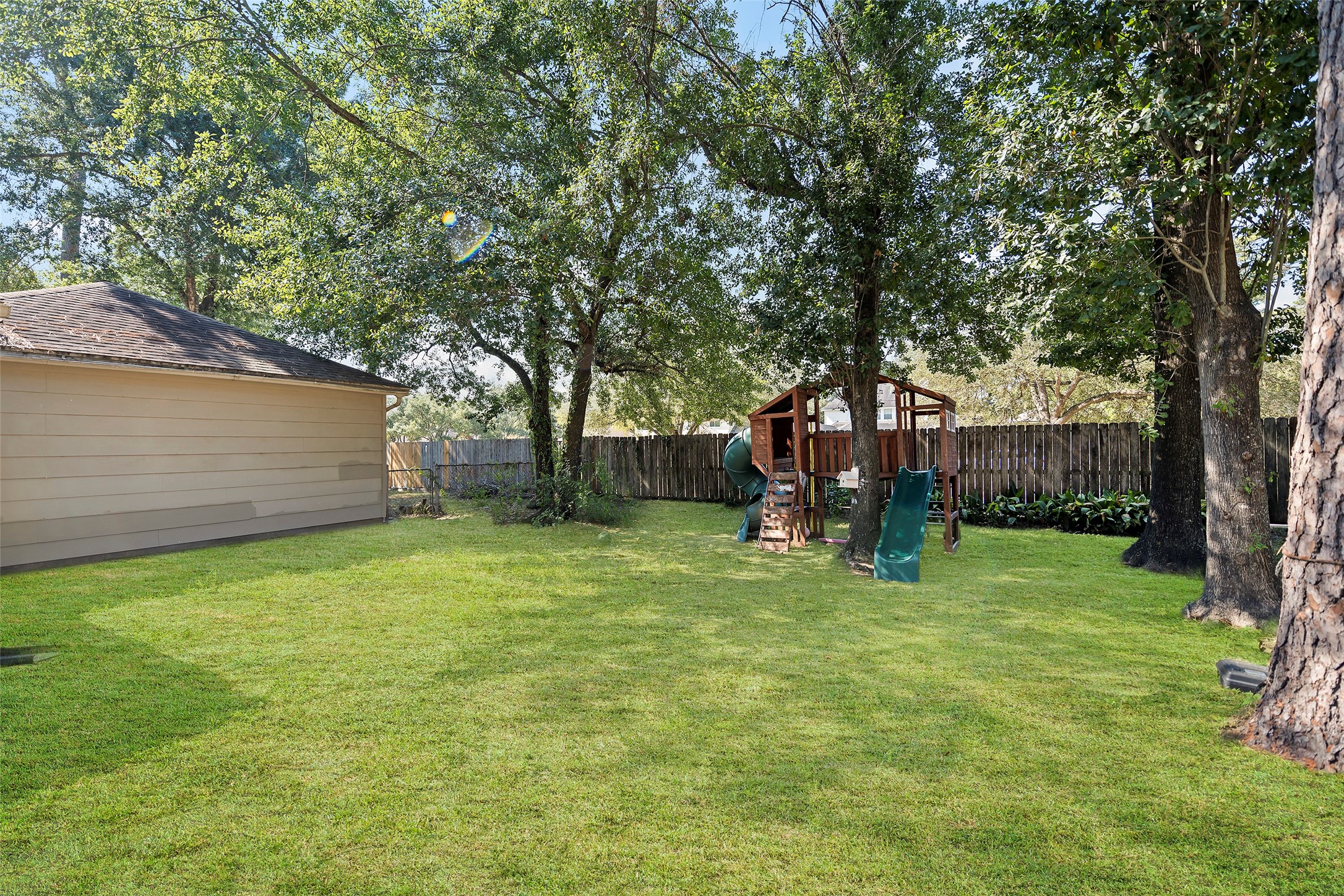 17607 Terrawren Lane Spring, TX 77379 - Photo 29 of 32 a view of a backyard with a tree