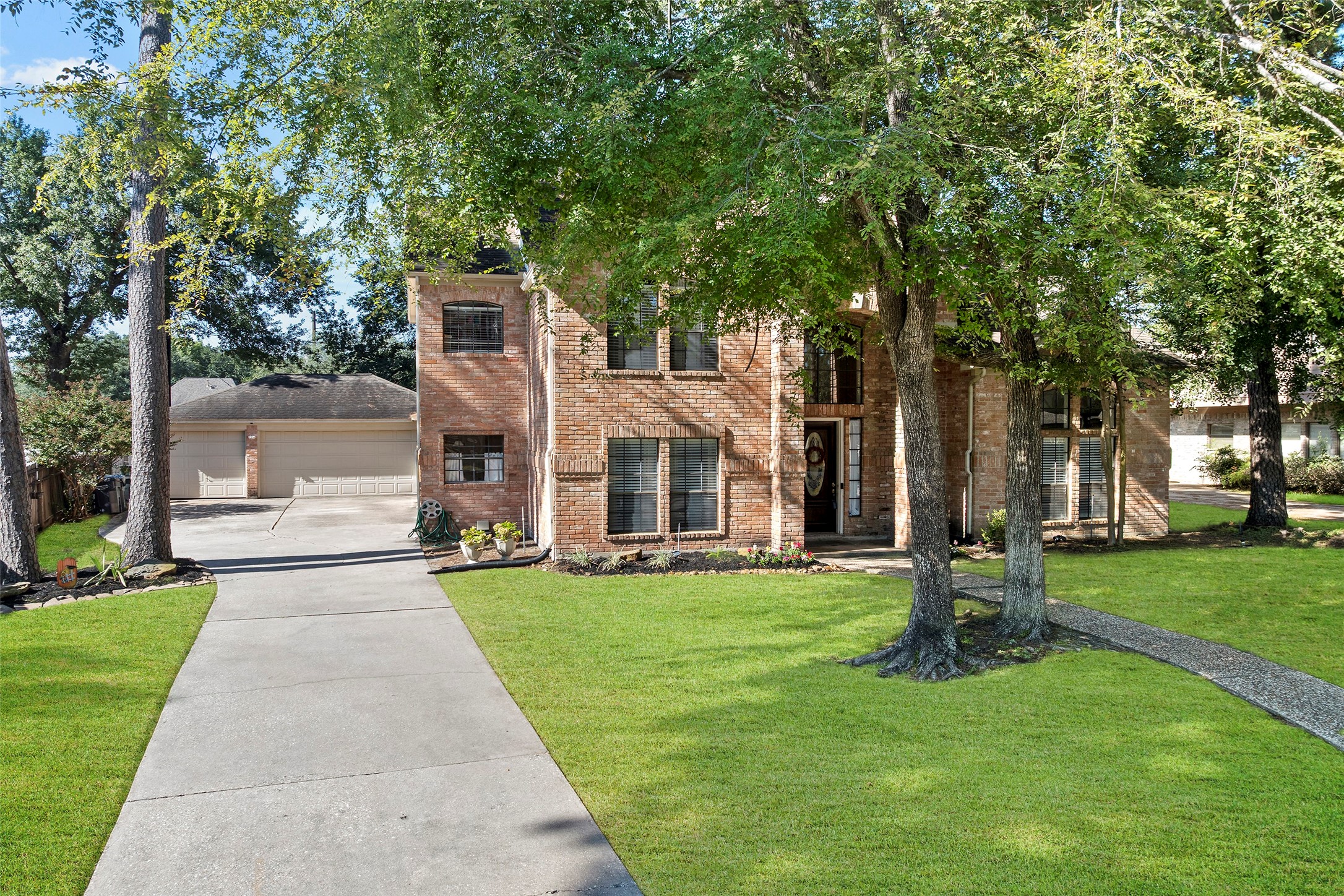 17607 Terrawren Lane Spring, TX 77379 - Photo 3 of 32 a front view of a building with a garden