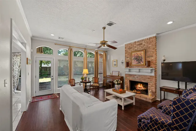 a living room with furniture fireplace and a flat screen tv