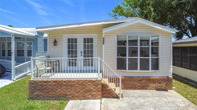 a view of front door and wooden fence