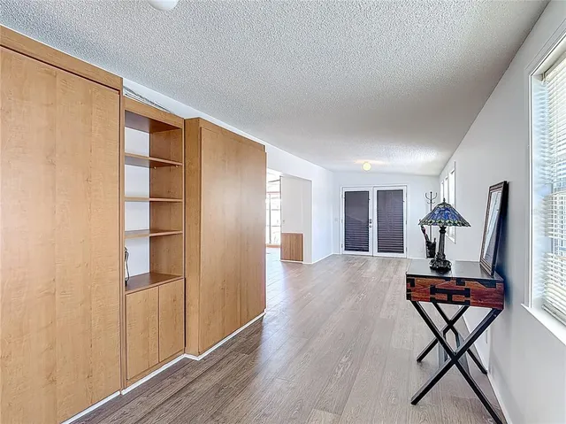 a view of a livingroom with furniture and wooden floor