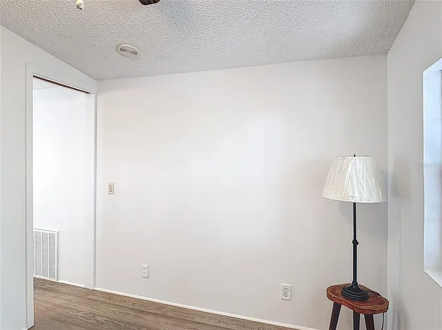 a room with a table and a lamp