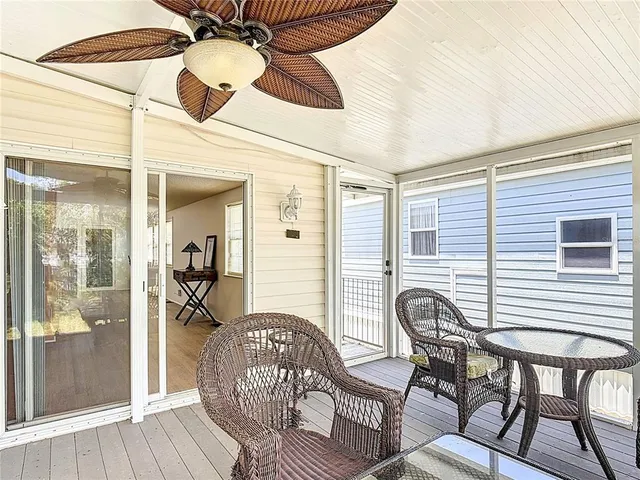 a view of a dining room and hall with furniture