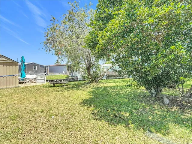 a house view with swimming pool in front of it