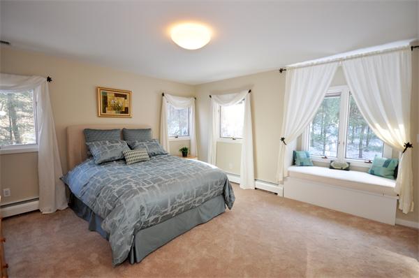 328 Border Road Concord, MA 01742 - Photo 11 of 14 a spacious bedroom with a bed and a large window
