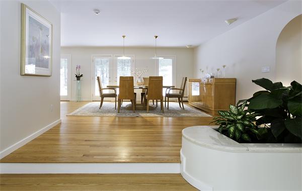 328 Border Road Concord, MA 01742 - Photo 5 of 14 a dining room with furniture potted plants and wooden floor