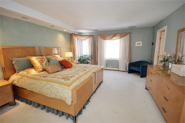 328 Border Road Concord, MA 01742 - Photo 8 of 14 a spacious bedroom with a bed and a couch
