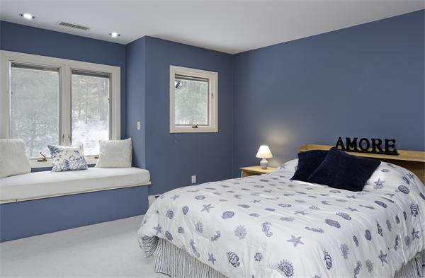 328 Border Road Concord, MA 01742 - Photo 10 of 14 a bedroom with a bed and a lamp