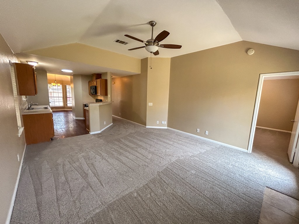 1604 Harness Race Way Pflugerville, TX 78660 - Photo 13 of 25 a view of a kitchen with a sink stainless steel appliances