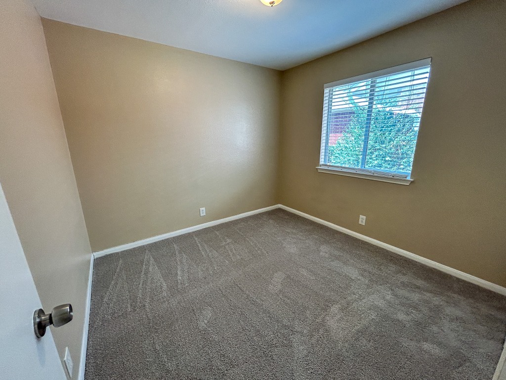 1604 Harness Race Way Pflugerville, TX 78660 - Photo 21 of 25 an empty room with a window