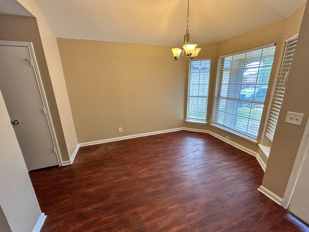 1604 Harness Race Way Pflugerville, TX 78660 - Photo 4 of 25 a view of livingroom with hardwood floor and window