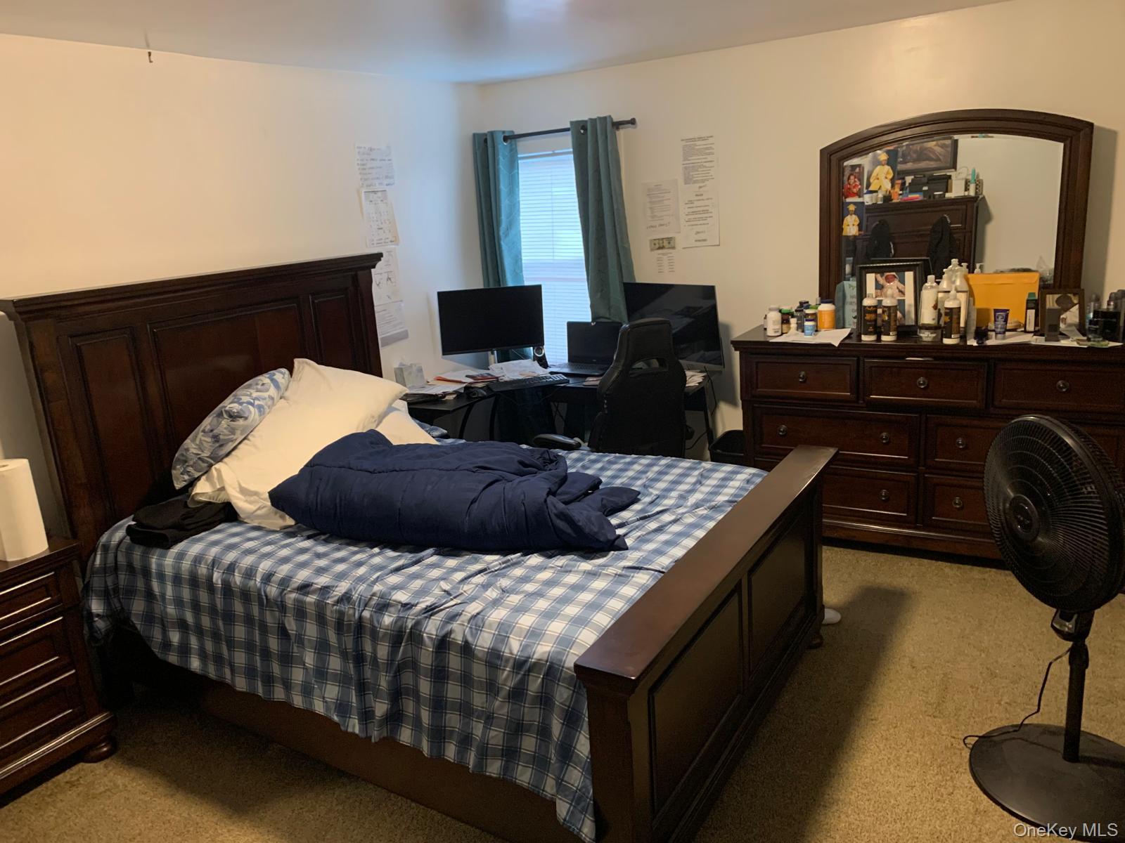 217-05 104th Avenue Queens, NY 11429 - Photo 17 of 43 a bedroom with a bed and wooden floor