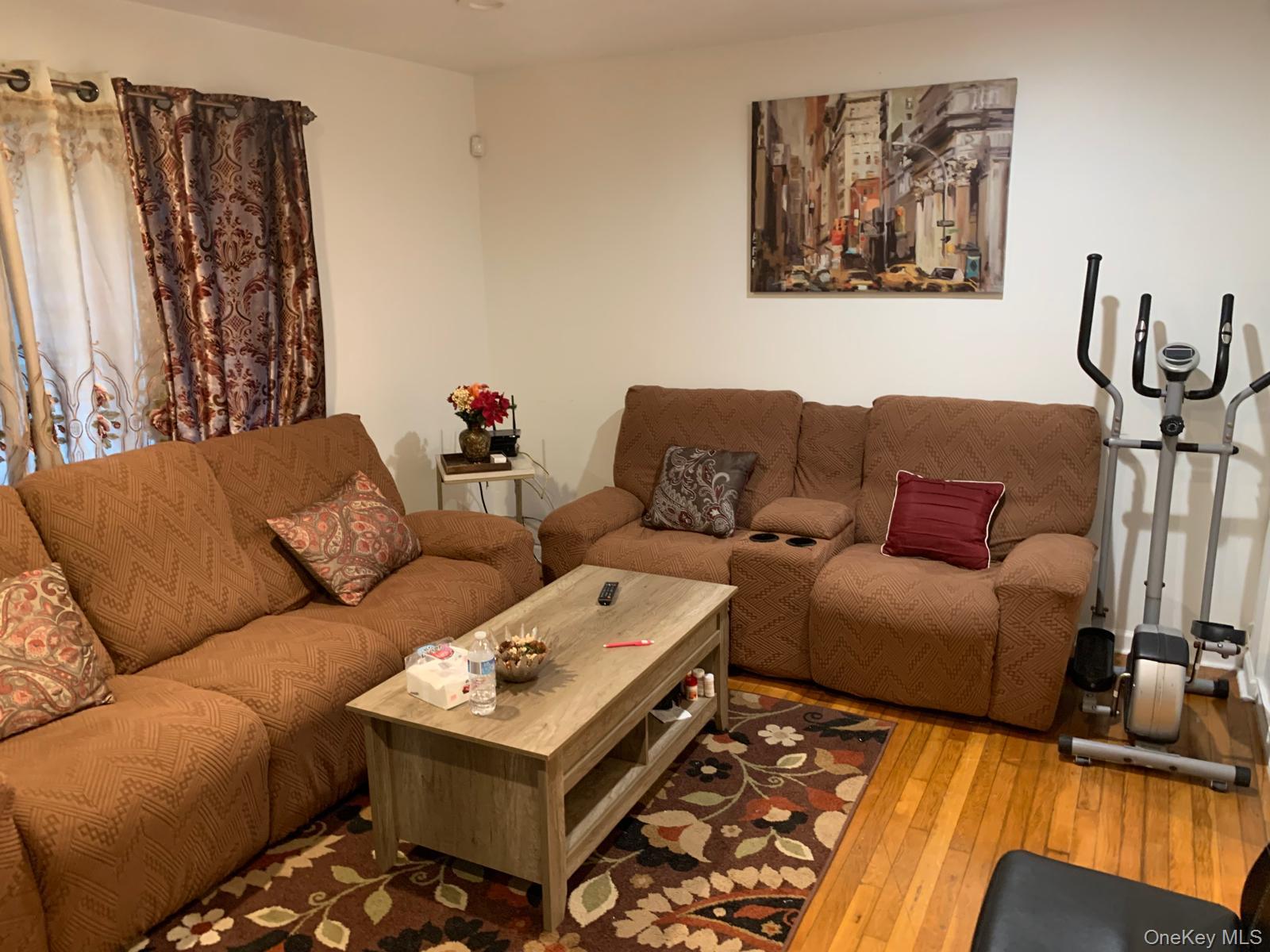 217-05 104th Avenue Queens, NY 11429 - Photo 26 of 43 a living room with furniture and a couch