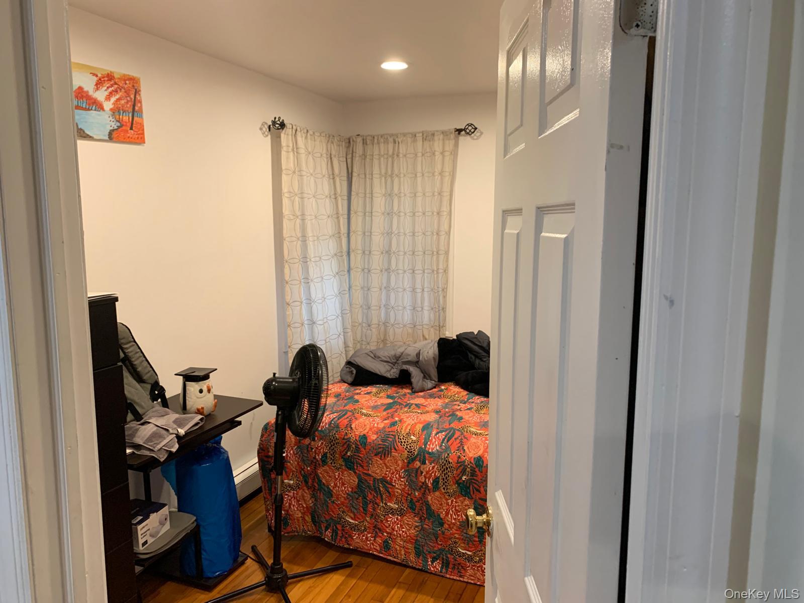 217-05 104th Avenue Queens, NY 11429 - Photo 28 of 43 a bedroom with a bed and a window