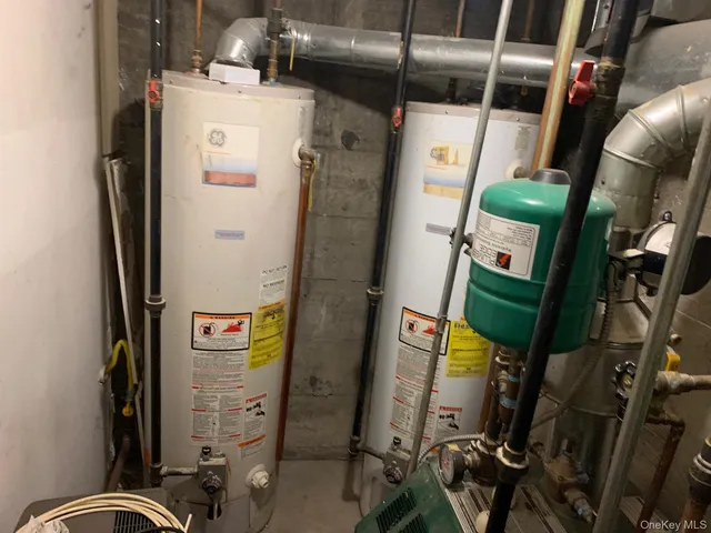 a bedroom with two beds and a window