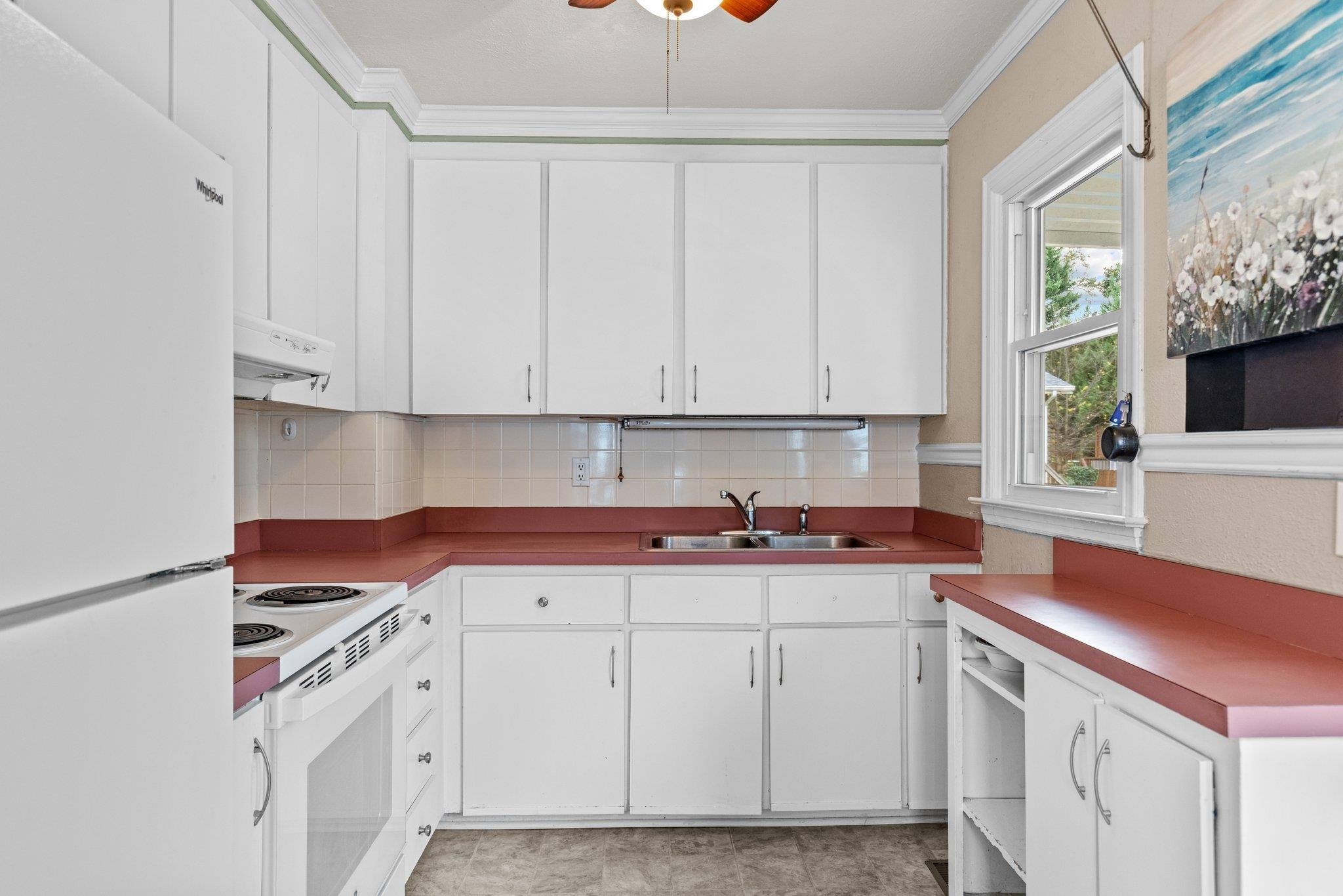 1805 Rankin Street Raleigh, NC 27604 - Photo 9 of 15 a kitchen with stainless steel appliances granite countertop a sink and a stove