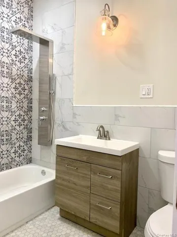 an empty room with wooden floor and closet