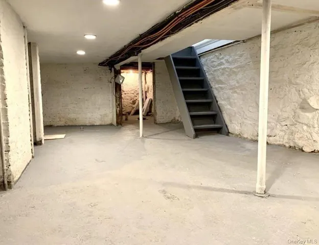 a view of an empty room with stairs