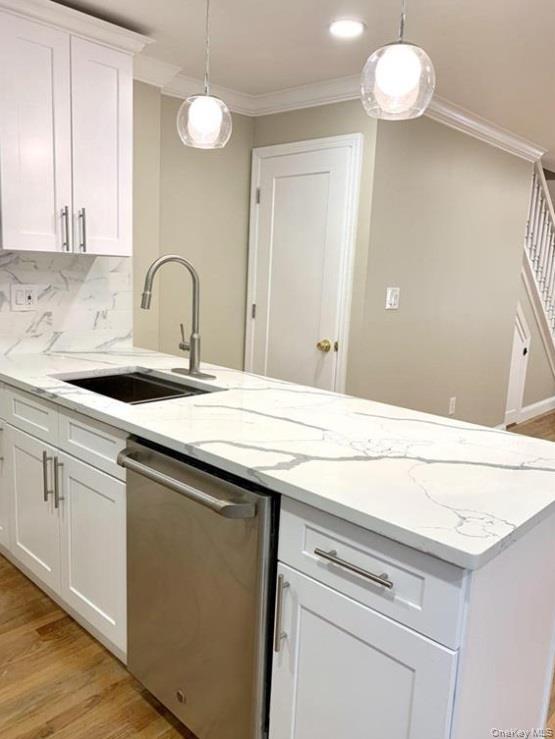 2301 Bathgate Avenue Bronx, NY 10458 - Photo 7 of 25 a sink a chandelier fan and cabinets