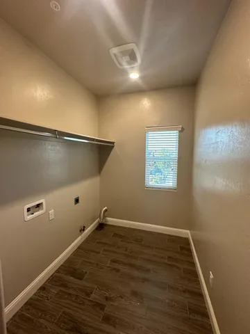 an empty room with wooden floor