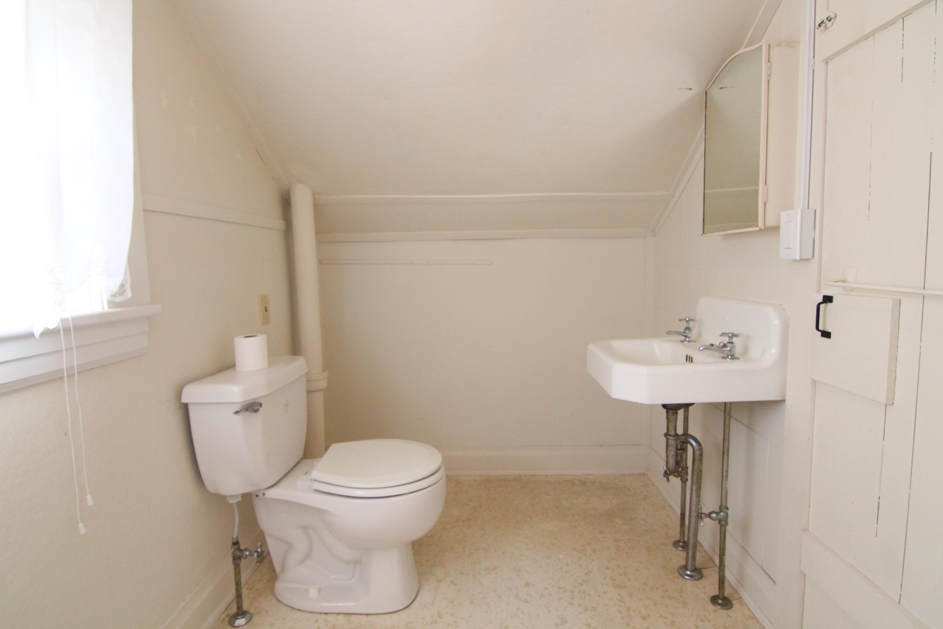 3655 Ventnor Road Southeast Roanoke, VA 24014 - Photo 22 of 27 a bathroom with a toilet sink and mirror