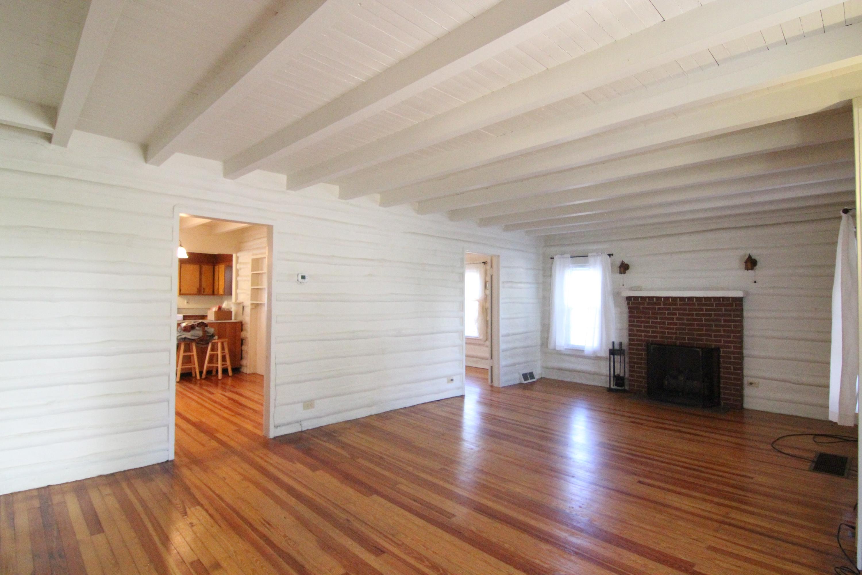 3655 Ventnor Road Southeast Roanoke, VA 24014 - Photo 5 of 27 wooden floor in an empty room with a fireplace