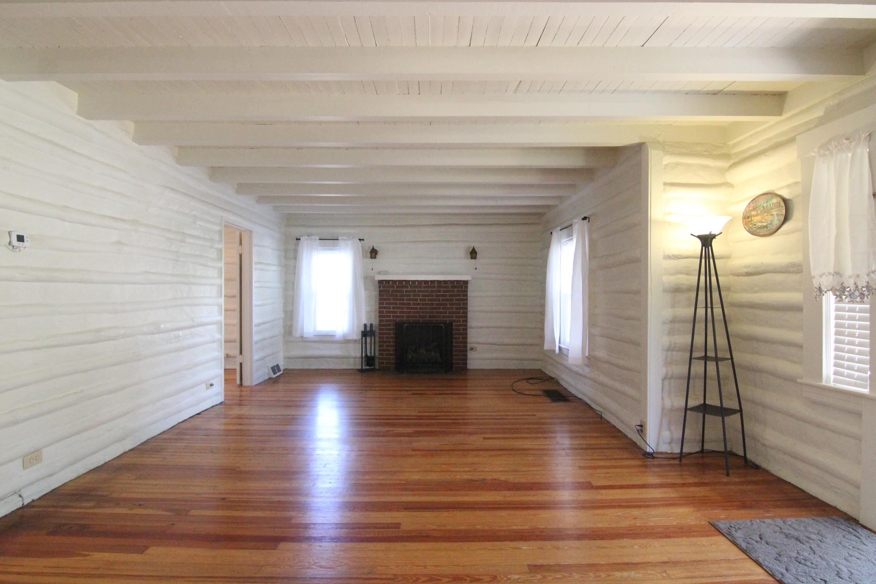3655 Ventnor Road Southeast Roanoke, VA 24014 - Photo 6 of 27 a view of a livingroom with wooden floor and a fireplace