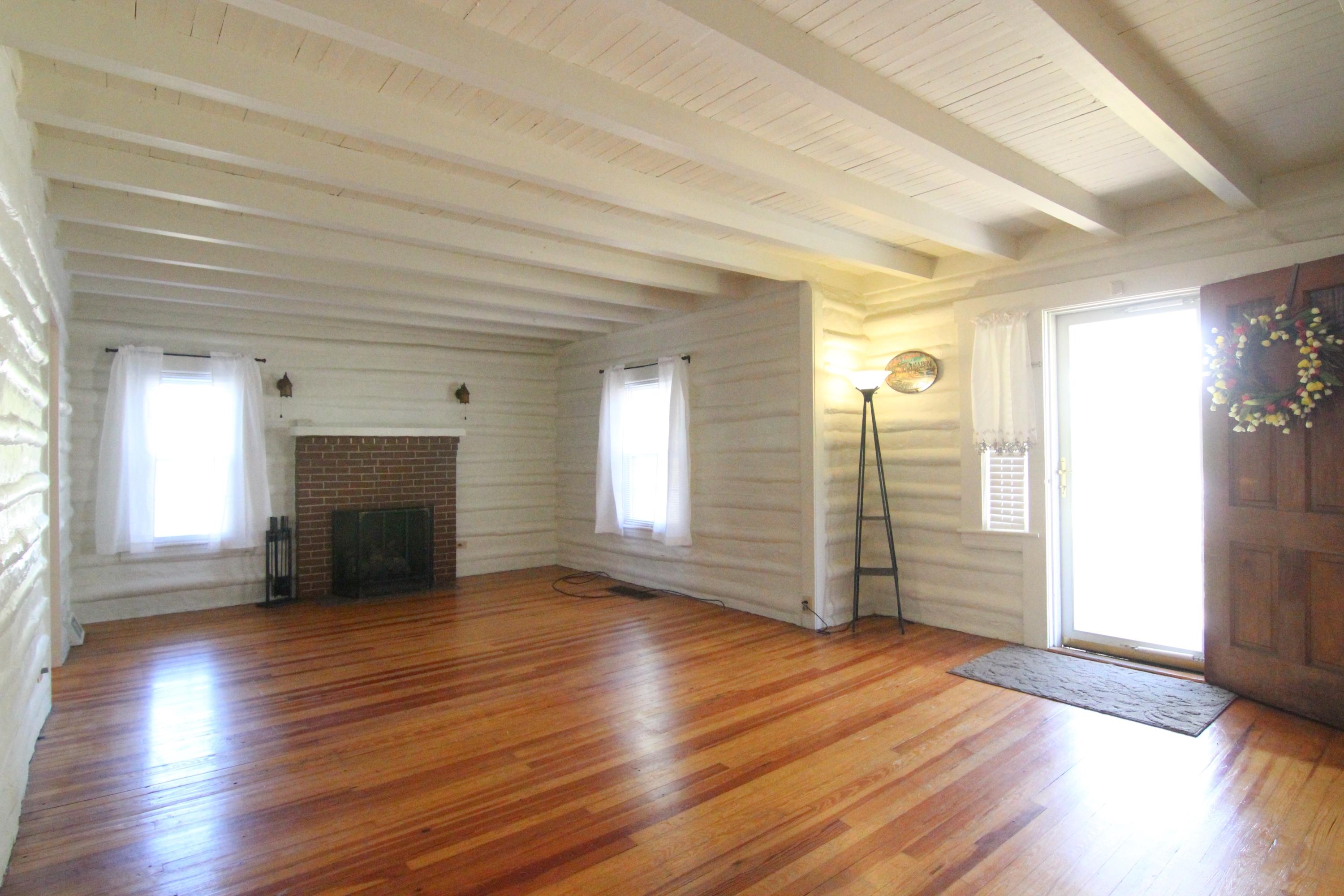 3655 Ventnor Road Southeast Roanoke, VA 24014 - Photo 7 of 27 an empty room with wooden floor and windows