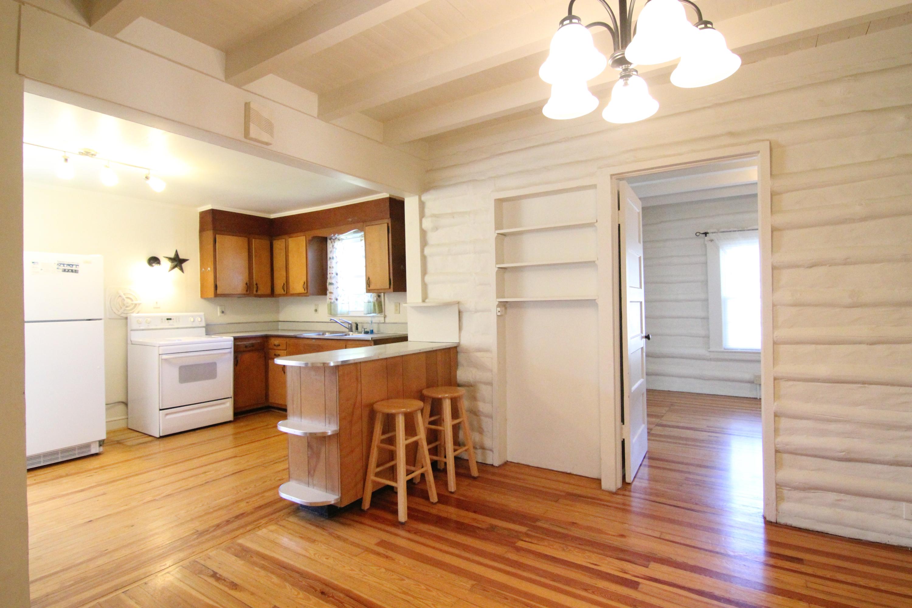 3655 Ventnor Road Southeast Roanoke, VA 24014 - Photo 9 of 27 a kitchen with a refrigerator cabinets and wooden floor
