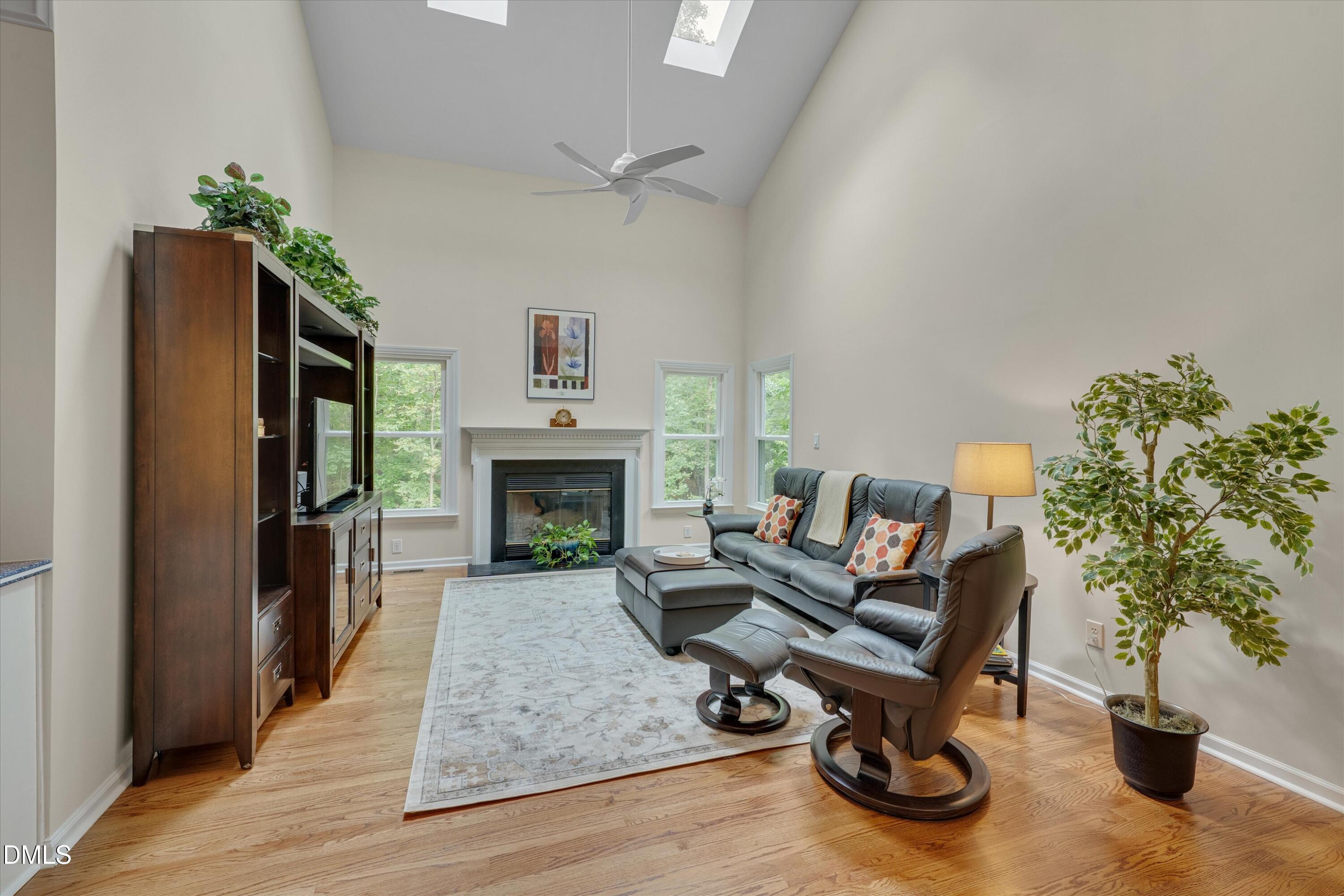 205 Cates Farm Road Chapel Hill, NC 27516 - Photo 12 of 56 a living room with furniture floor to ceiling window and a fireplace