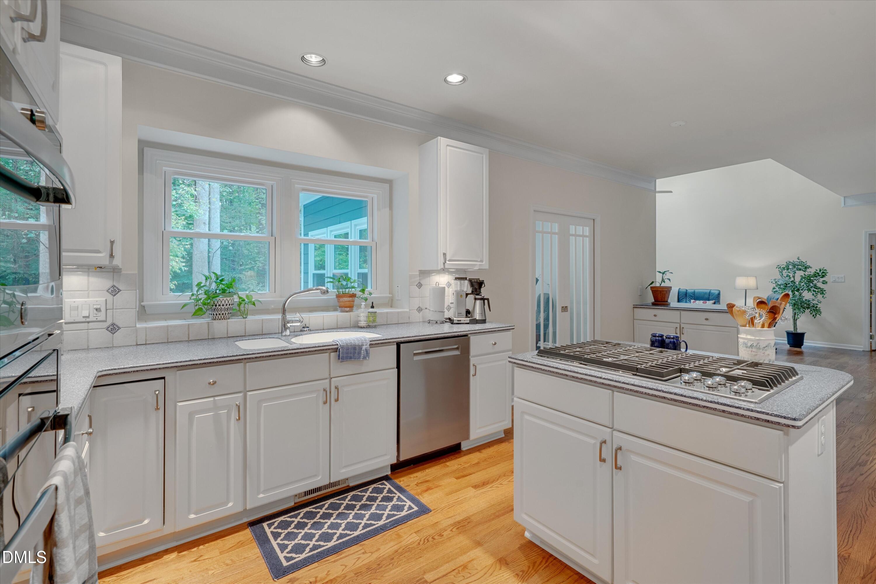 205 Cates Farm Road Chapel Hill, NC 27516 - Photo 18 of 56 a kitchen with a sink stove and window