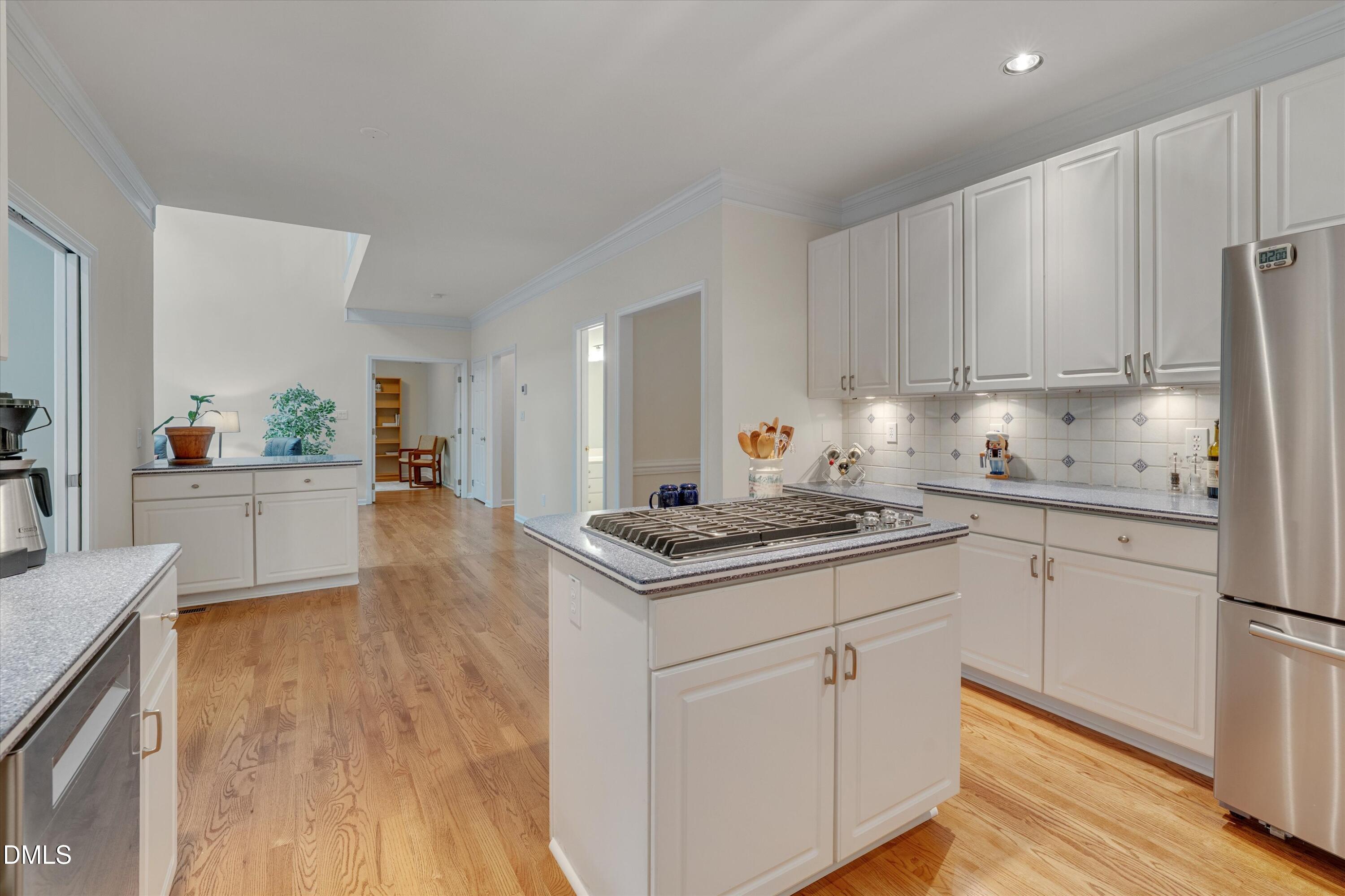 205 Cates Farm Road Chapel Hill, NC 27516 - Photo 19 of 56 a kitchen with stainless steel appliances granite countertop a sink stove and refrigerator