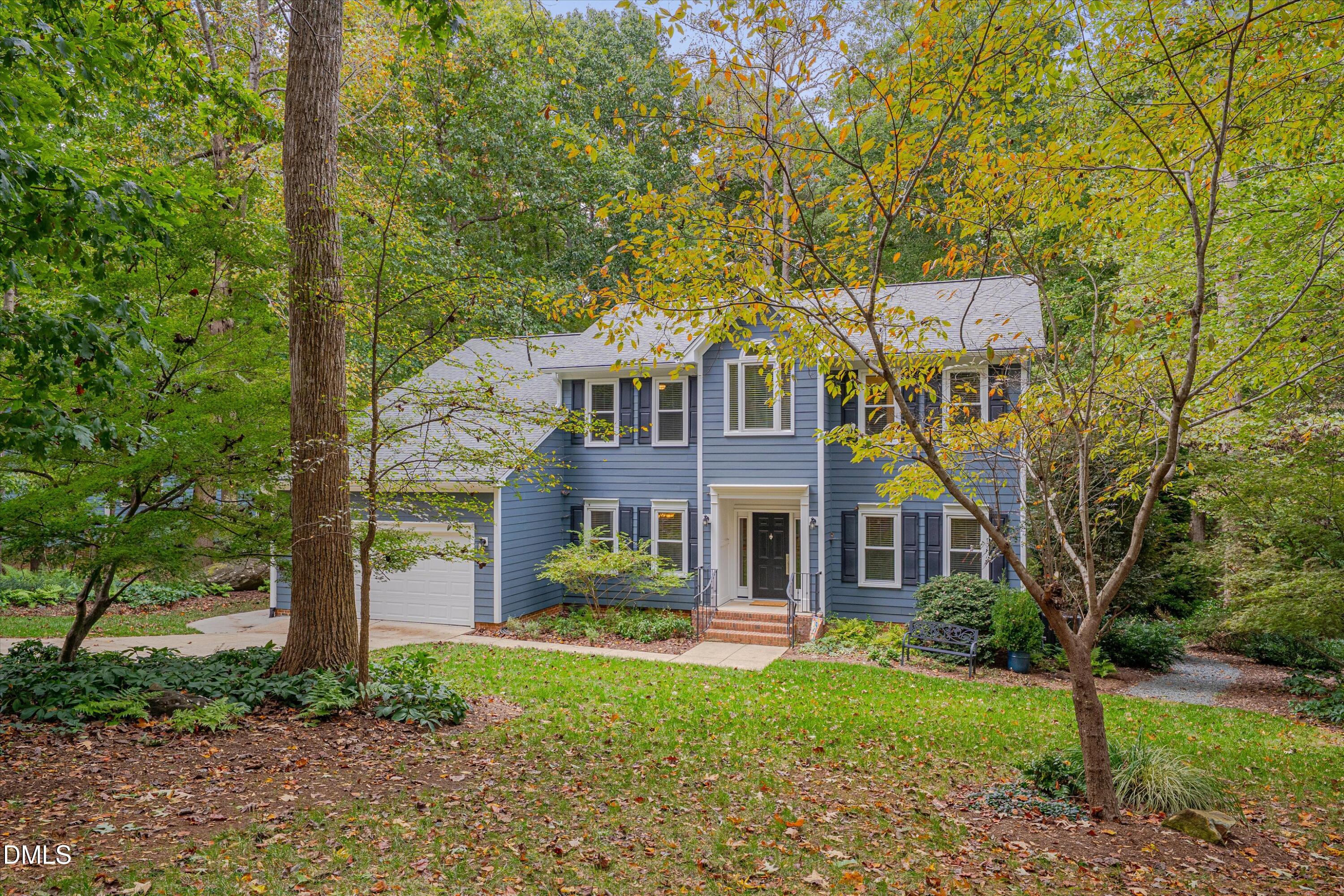205 Cates Farm Road Chapel Hill, NC 27516 - Photo 2 of 56 a front view of a house with a yard
