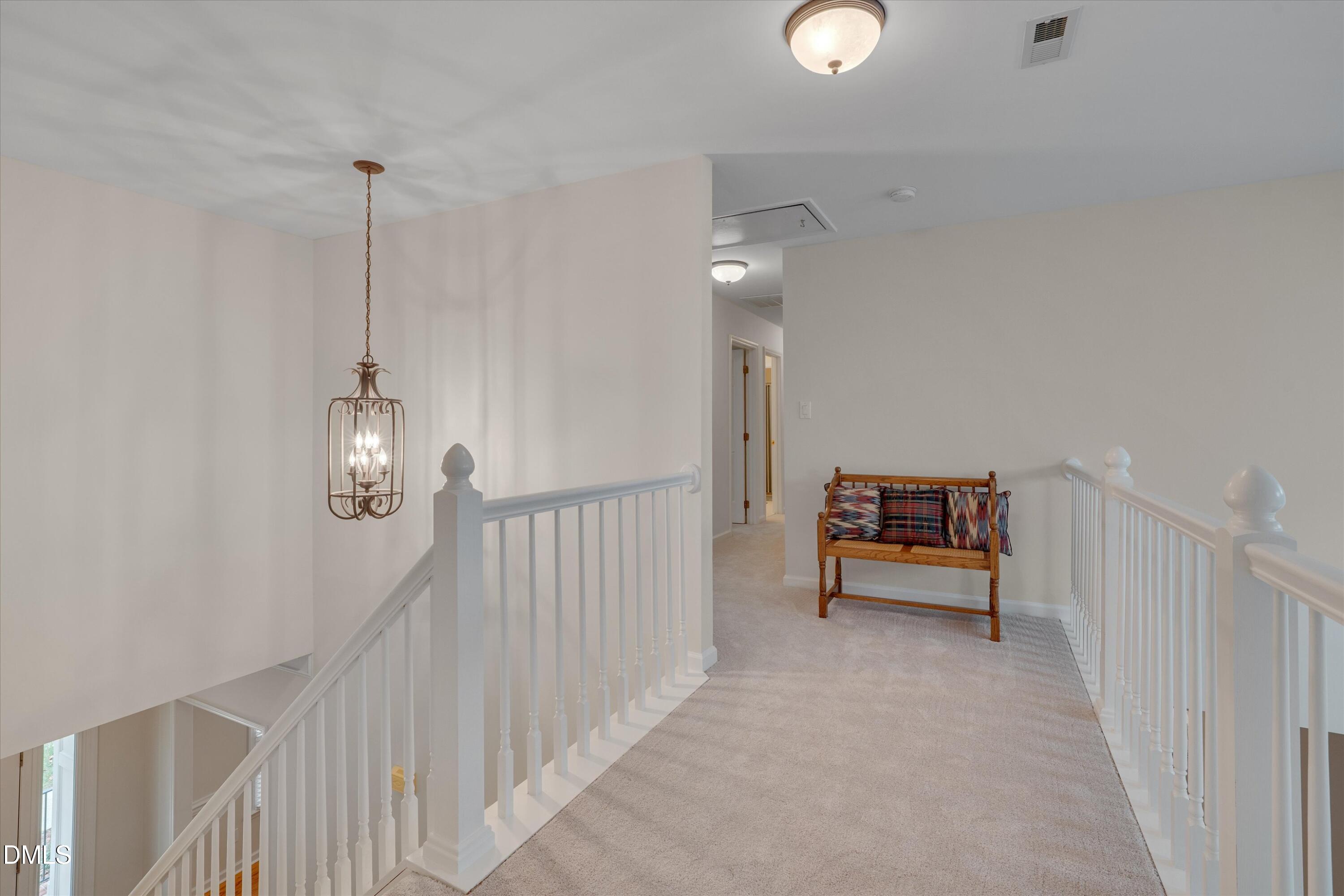 205 Cates Farm Road Chapel Hill, NC 27516 - Photo 27 of 56 a view of a hallway with entryway wooden floor and windows