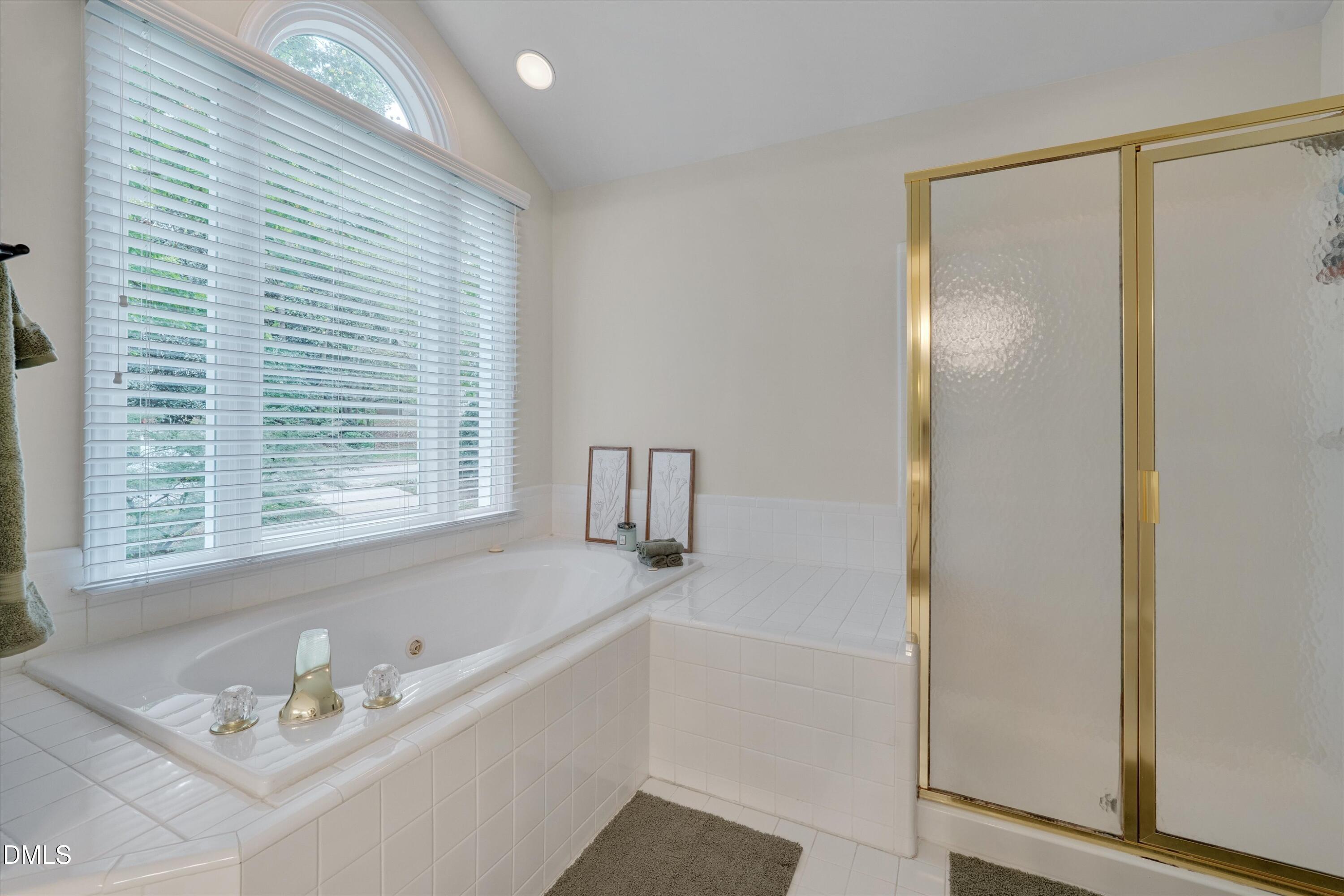 205 Cates Farm Road Chapel Hill, NC 27516 - Photo 33 of 56 a bathroom with a bathtub and a sink