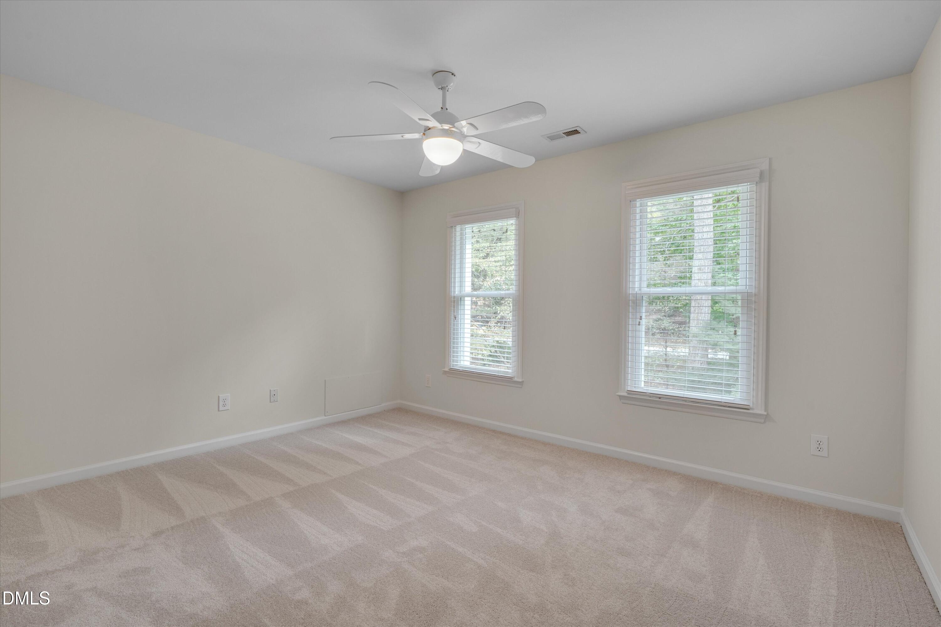 205 Cates Farm Road Chapel Hill, NC 27516 - Photo 36 of 56 an empty room with windows and fan