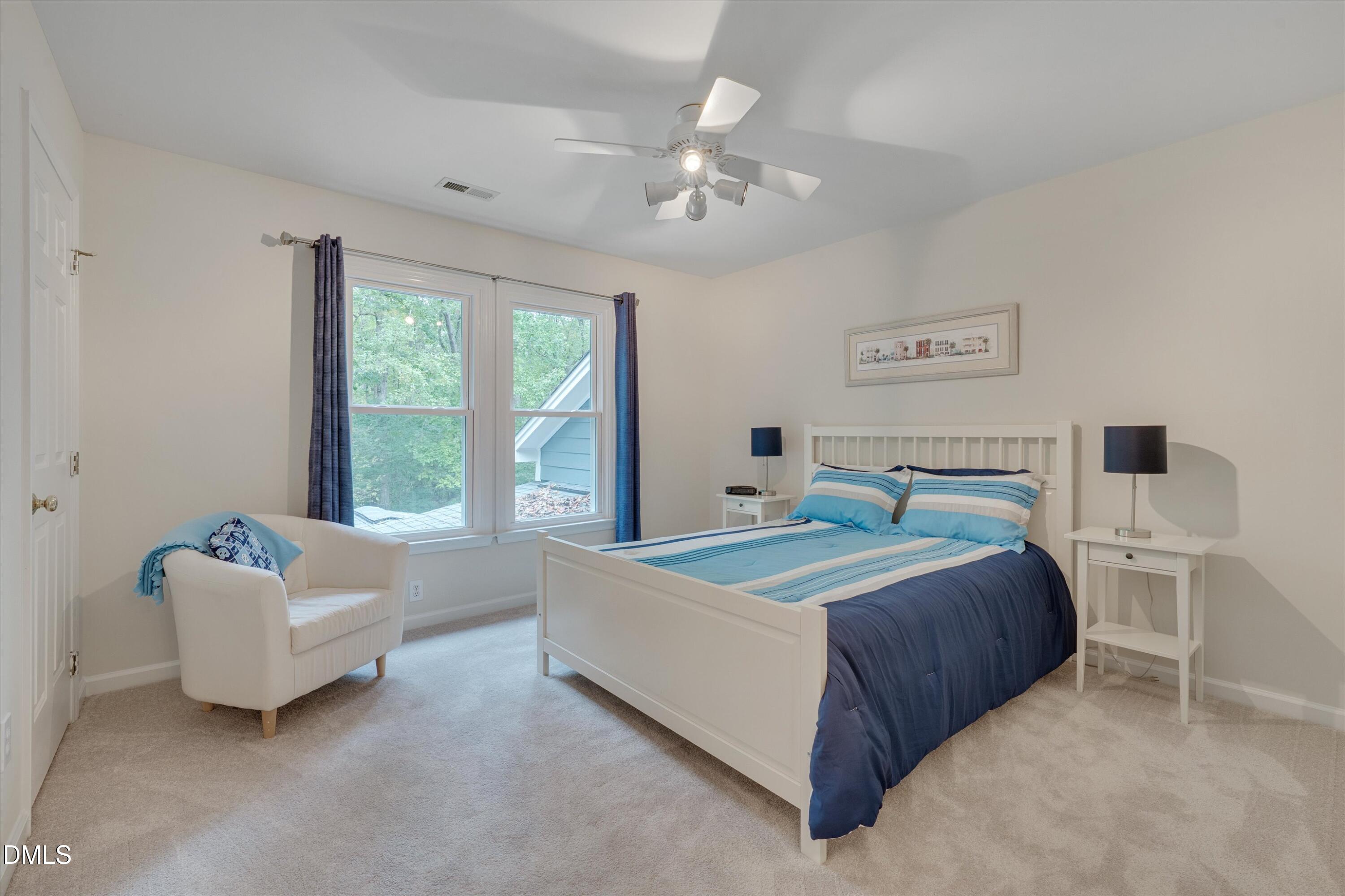 205 Cates Farm Road Chapel Hill, NC 27516 - Photo 39 of 56 a bedroom with a bed and a couch